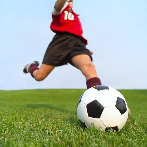 Young athlete preparing to strike the soccer ball.